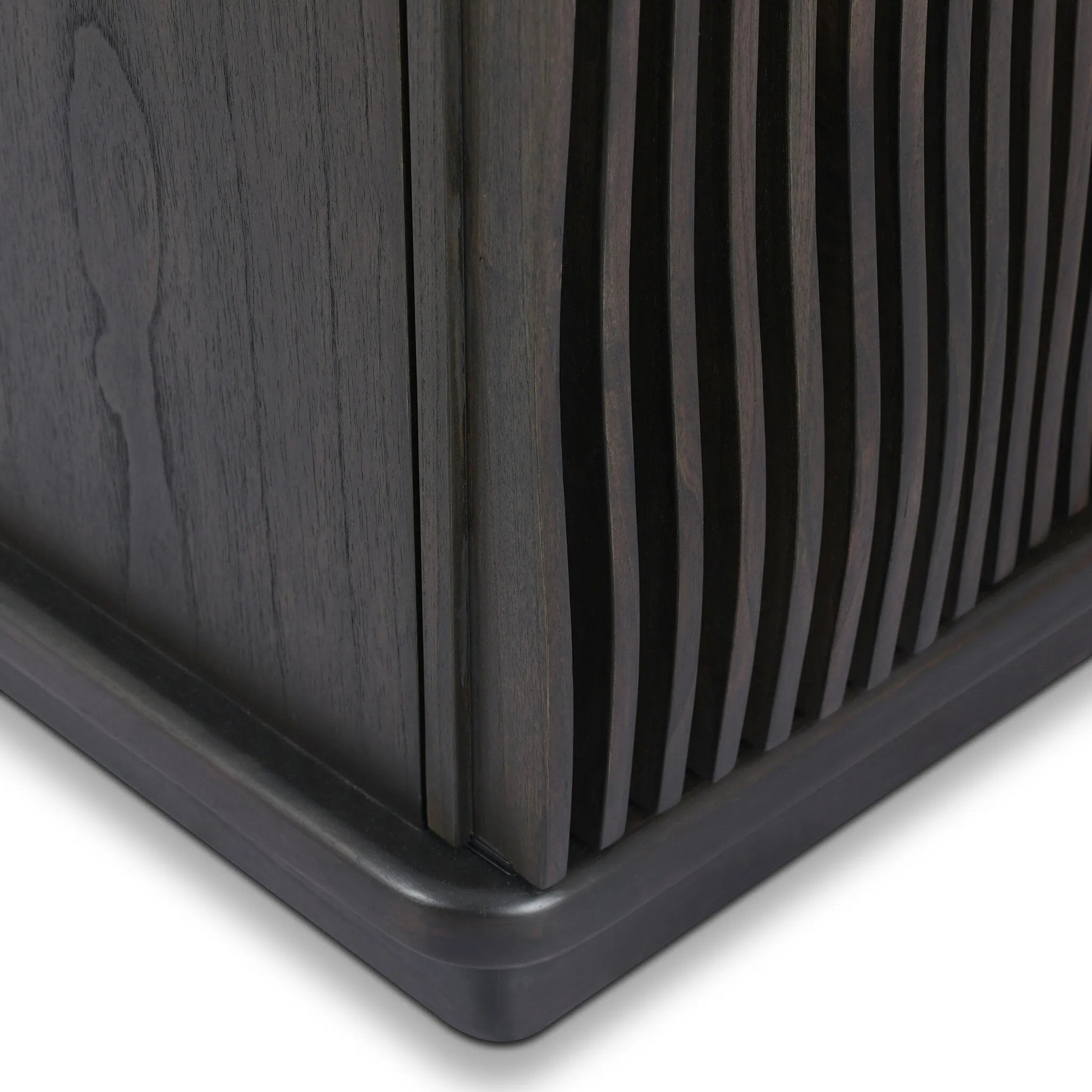 Bring a truly unique look to the dining or living space with this stunning sideboard inspired by rolling ocean tides. Crafted of solid mindi and mindi veneer, a stunning front features repetitive, flow-like reeding that's been precision-cut in individual pieces and assembled onto the doors, creating deep curves reminiscent of rippling waves. Amethyst Home provides interior design, new home construction design consulting, vintage area rugs, and lighting in the Alpharetta metro area.