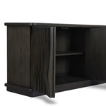 Bring a truly unique look to the dining or living space with this stunning sideboard inspired by rolling ocean tides. Crafted of solid mindi and mindi veneer, a stunning front features repetitive, flow-like reeding that's been precision-cut in individual pieces and assembled onto the doors, creating deep curves reminiscent of rippling waves. Amethyst Home provides interior design, new home construction design consulting, vintage area rugs, and lighting in the Calabasas metro area.