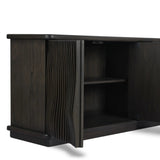 Bring a truly unique look to the dining or living space with this stunning sideboard inspired by rolling ocean tides. Crafted of solid mindi and mindi veneer, a stunning front features repetitive, flow-like reeding that's been precision-cut in individual pieces and assembled onto the doors, creating deep curves reminiscent of rippling waves. Amethyst Home provides interior design, new home construction design consulting, vintage area rugs, and lighting in the Calabasas metro area.