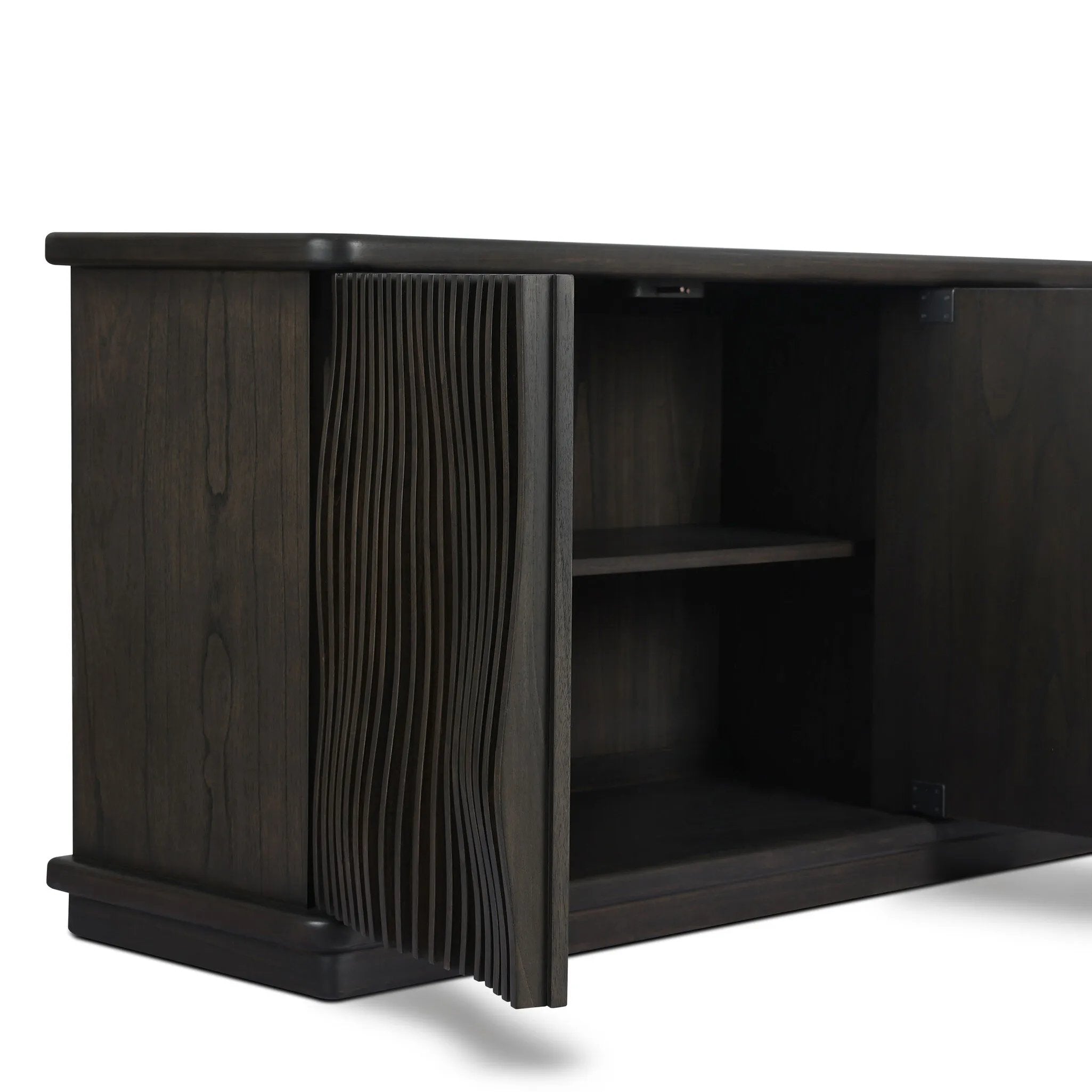 Bring a truly unique look to the dining or living space with this stunning sideboard inspired by rolling ocean tides. Crafted of solid mindi and mindi veneer, a stunning front features repetitive, flow-like reeding that's been precision-cut in individual pieces and assembled onto the doors, creating deep curves reminiscent of rippling waves. Amethyst Home provides interior design, new home construction design consulting, vintage area rugs, and lighting in the Calabasas metro area.