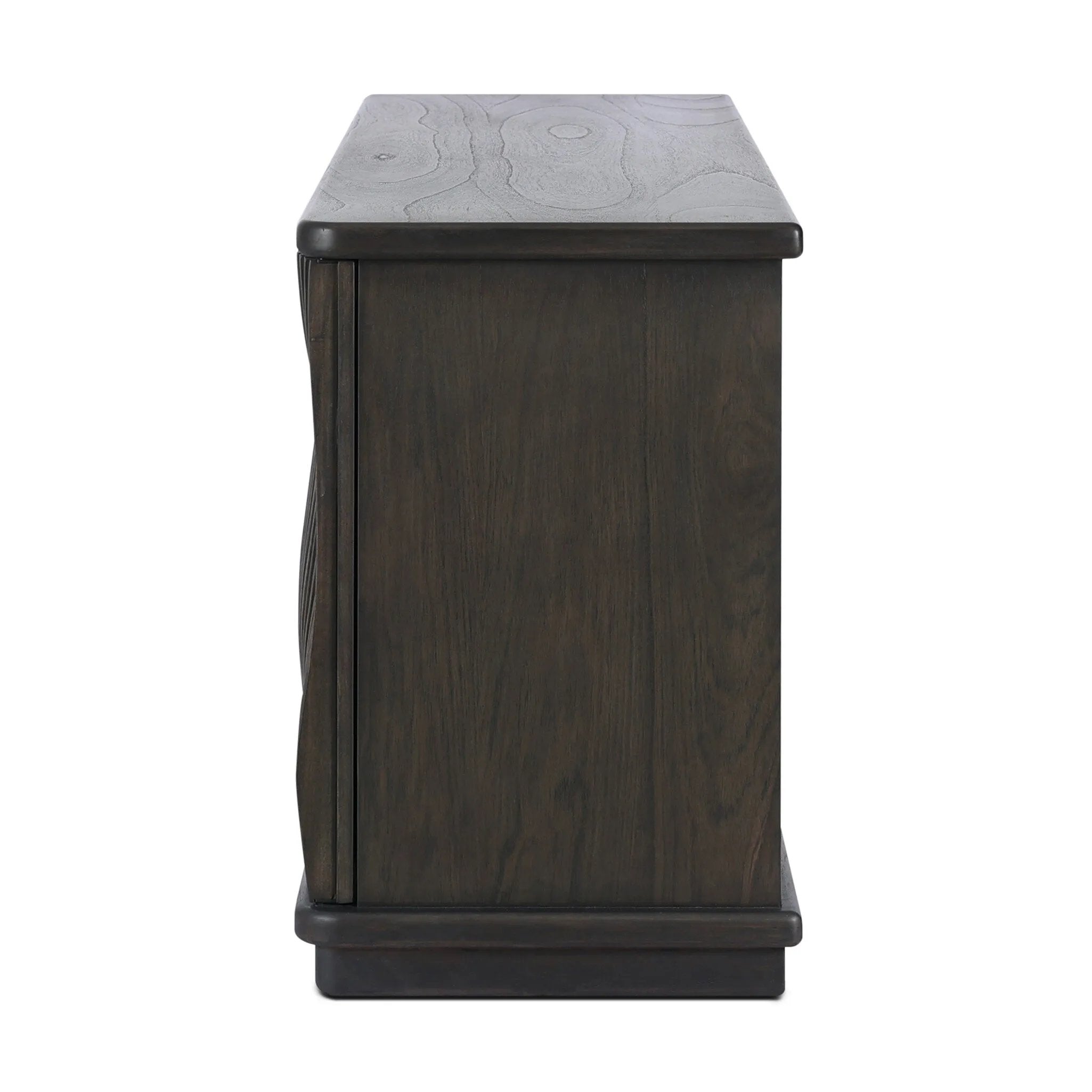 Bring a truly unique look to the dining or living space with this stunning sideboard inspired by rolling ocean tides. Crafted of solid mindi and mindi veneer, a stunning front features repetitive, flow-like reeding that's been precision-cut in individual pieces and assembled onto the doors, creating deep curves reminiscent of rippling waves. Amethyst Home provides interior design, new home construction design consulting, vintage area rugs, and lighting in the Houston metro area.