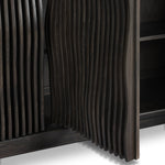 Bring a truly unique look to the dining or living space with this stunning sideboard inspired by rolling ocean tides. Crafted of solid mindi and mindi veneer, a stunning front features repetitive, flow-like reeding that's been precision-cut in individual pieces and assembled onto the doors, creating deep curves reminiscent of rippling waves. Amethyst Home provides interior design, new home construction design consulting, vintage area rugs, and lighting in the Los Angeles metro area.