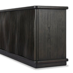 Bring a truly unique look to the dining or living space with this stunning sideboard inspired by rolling ocean tides. Crafted of solid mindi and mindi veneer, a stunning front features repetitive, flow-like reeding that's been precision-cut in individual pieces and assembled onto the doors, creating deep curves reminiscent of rippling waves. Amethyst Home provides interior design, new home construction design consulting, vintage area rugs, and lighting in the Tampa metro area.