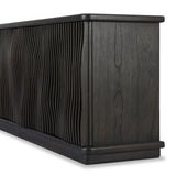 Bring a truly unique look to the dining or living space with this stunning sideboard inspired by rolling ocean tides. Crafted of solid mindi and mindi veneer, a stunning front features repetitive, flow-like reeding that's been precision-cut in individual pieces and assembled onto the doors, creating deep curves reminiscent of rippling waves. Amethyst Home provides interior design, new home construction design consulting, vintage area rugs, and lighting in the Tampa metro area.