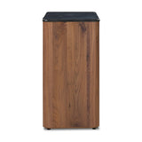 Design your space with hallmark features inspired by soft Brutalism. Made from solid walnut and poplar woods with a natural finish, the cabinet is topped with a black marble top with half bullnose edging for smooth contours. Double doors open to two shelves for ample storage. High-quality hardware is crafted from black iron. Amethyst Home provides interior design, new home construction design consulting, vintage area rugs, and lighting in the Boston metro area.