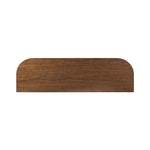 Dark brown walnut is aesthetically shaped with fluid, rounded corners on a ski leg base. The seamless design features six spacious drawers with metal bar hardware that runs along the tops of the drawers Amethyst Home provides interior design, new home construction design consulting, vintage area rugs, and lighting in the Charlotte metro area.