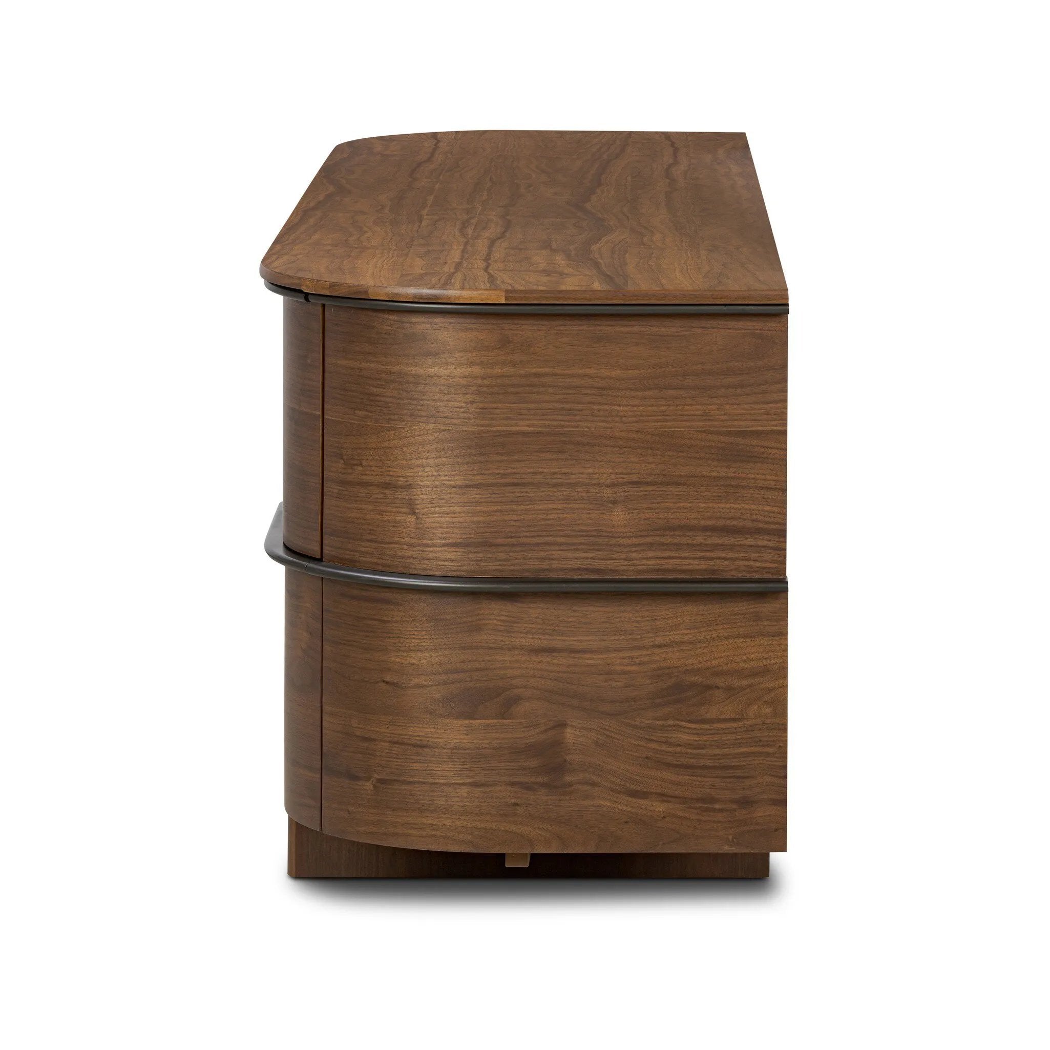 Dark brown walnut is aesthetically shaped with fluid, rounded corners on a ski leg base. The seamless design features six spacious drawers with metal bar hardware that runs along the tops of the drawers Amethyst Home provides interior design, new home construction design consulting, vintage area rugs, and lighting in the Dallas metro area.