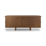 Dark brown walnut is aesthetically shaped with fluid, rounded corners on a ski leg base. The seamless design features six spacious drawers with metal bar hardware that runs along the tops of the drawers Amethyst Home provides interior design, new home construction design consulting, vintage area rugs, and lighting in the Monterey metro area.