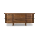 Dark brown walnut is aesthetically shaped with fluid, rounded corners on a ski leg base. The seamless design features six spacious drawers with metal bar hardware that runs along the tops of the drawers Amethyst Home provides interior design, new home construction design consulting, vintage area rugs, and lighting in the Scottsdale metro area.