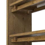 Featuring Theodore Rustic Amber Oak Veneer Bookcase by Four Hands at Amethyst Home. Wide and stately, with plenty of space for storage and display. A bookcase made from rustic amber-finished oak shapes a wide floating shelf design, with layered cross supports bringing an architectural feel to the office or living room.Overall Dimensions: 60.00"w x 18.00. Amethyst Home provides interior design, new home construction design consulting, vintage area rugs, and lighting in the Winter Garden metro area.