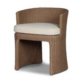 This outdoor dining chair takes on a curved silhouette, crafted from woven faux hyacinth and complemented by a heavily textured boucle cushion. Cover or store inside during inclement weather and when not in use.As lovers of natural materials at Amethyst, we love the designer inspired Thora Outdoor Dining Chair - Vada Cream. Amethyst Home provides interior design, new home construction design consulting, vintage area rugs, and lighting in the Miami metro area.