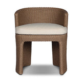 This outdoor dining chair takes on a curved silhouette, crafted from woven faux hyacinth and complemented by a heavily textured boucle cushion. Cover or store inside during inclement weather and when not in use.As lovers of natural materials at Amethyst, we love the designer inspired Thora Outdoor Dining Chair - Vada Cream. Amethyst Home provides interior design, new home construction design consulting, vintage area rugs, and lighting in the Tampa metro area.