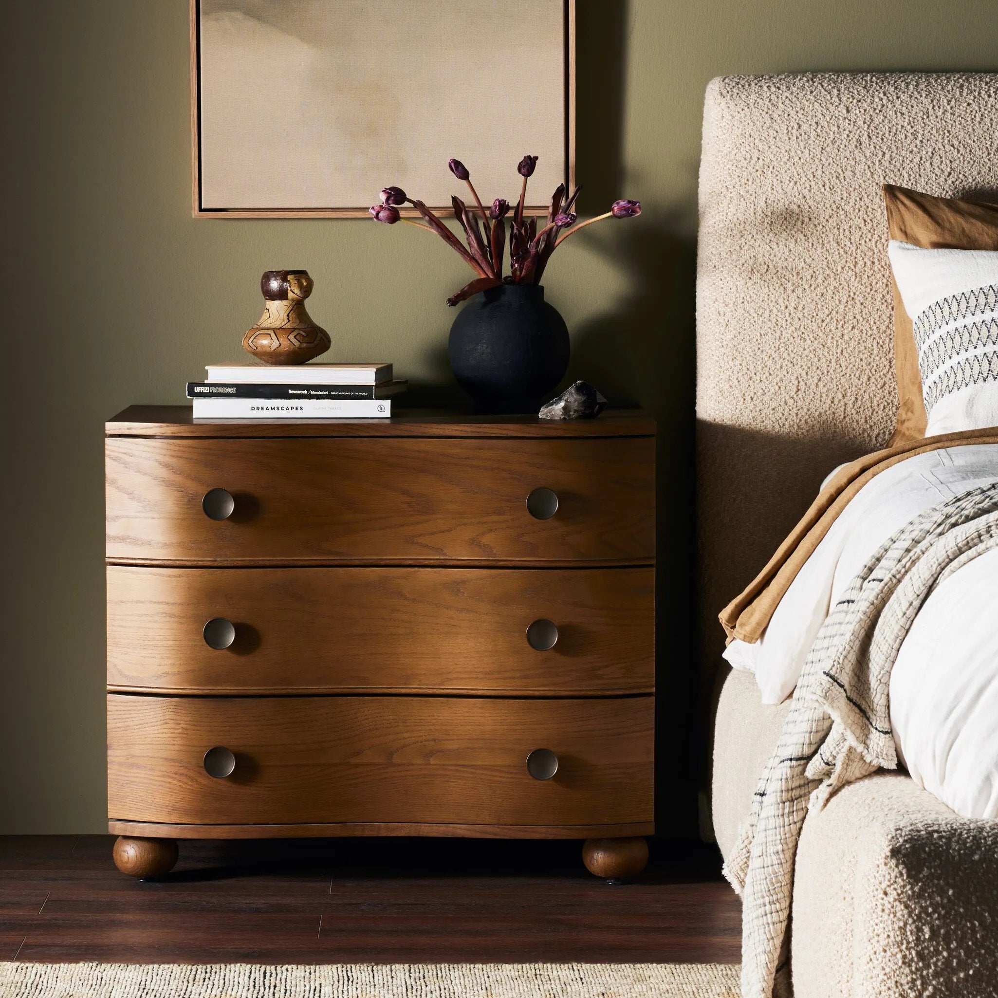 Made from solid oak and finished in a toasted oak, this three-drawer nightstand is inspired by European antiques to bring both style and storage space to the bedroom Amethyst Home provides interior design, new home construction design consulting, vintage area rugs, and lighting in the Los Angeles metro area.
