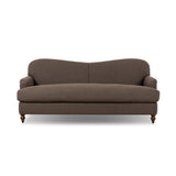 The traditional English roll-arm sofa gains refinement. Clean lines replace the fuss, retaining nothing but pure, effortless comfort. The sofa features a graceful reverse camelback and back-turned wooden legs, balanced by pleated arms and an exaggerated, voluminous seat cushion. Generously filled with feathers for added texture and character. Amethyst Home provides interior design, new home construction design consulting, vintage area rugs, and lighting in the Alpharetta metro area.