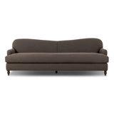 The traditional English roll-arm sofa gains refinement. Clean lines replace the fuss, retaining nothing but pure, effortless comfort. The sofa features a graceful reverse camelback and back-turned wooden legs, balanced by pleated arms and an exaggerated, voluminous seat cushion. Generously filled with feathers for added texture and character. Amethyst Home provides interior design, new home construction design consulting, vintage area rugs, and lighting in the Boston metro area.
