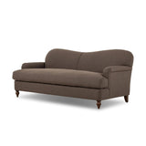 The traditional English roll-arm sofa gains refinement. Clean lines replace the fuss, retaining nothing but pure, effortless comfort. The sofa features a graceful reverse camelback and back-turned wooden legs, balanced by pleated arms and an exaggerated, voluminous seat cushion. Generously filled with feathers for added texture and character. Amethyst Home provides interior design, new home construction design consulting, vintage area rugs, and lighting in the Miami metro area.