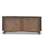 Store favorite table linens and serveware in this organically shaped sideboard of taupe-washed solid mango. A beautifully curved silhouette is complemented by rounded tapered legs and a clean four-door format.As lovers of modern materials at Amethyst, we love the nature inspired Tindra Sideboard - Washed Taupe Mango. Amethyst Home provides interior design, new home construction design consulting, vintage area rugs, and lighting in the San Diego metro area.