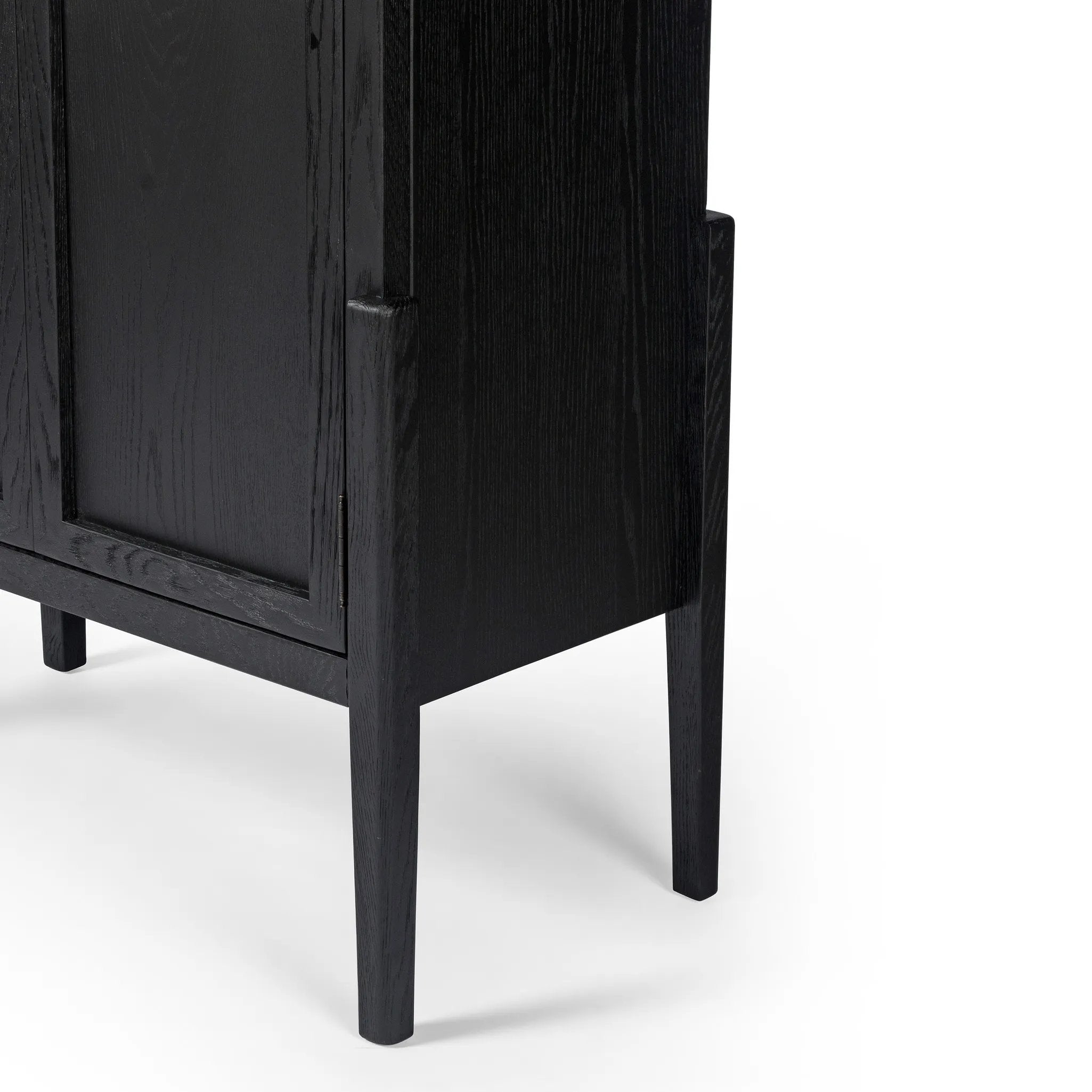 Featuring Tolle Drifted Matte Black Panel Door Cabinet by Four Hands at Amethyst Home. Store it in style. Beautifully shaped cabinetry in drifted matte black veneer features spacious interior shelving and recessed wood panel doors, ready for storing your treasures.Overall Dimensions: 38.00"w x 19.00"d x 84.00"hWeight : 169.75 lbsMaterials: Solid Oak, Oak Ven. Amethyst Home provides interior design, new home construction design consulting, vintage area rugs, and lighting in the Portland metro area.
