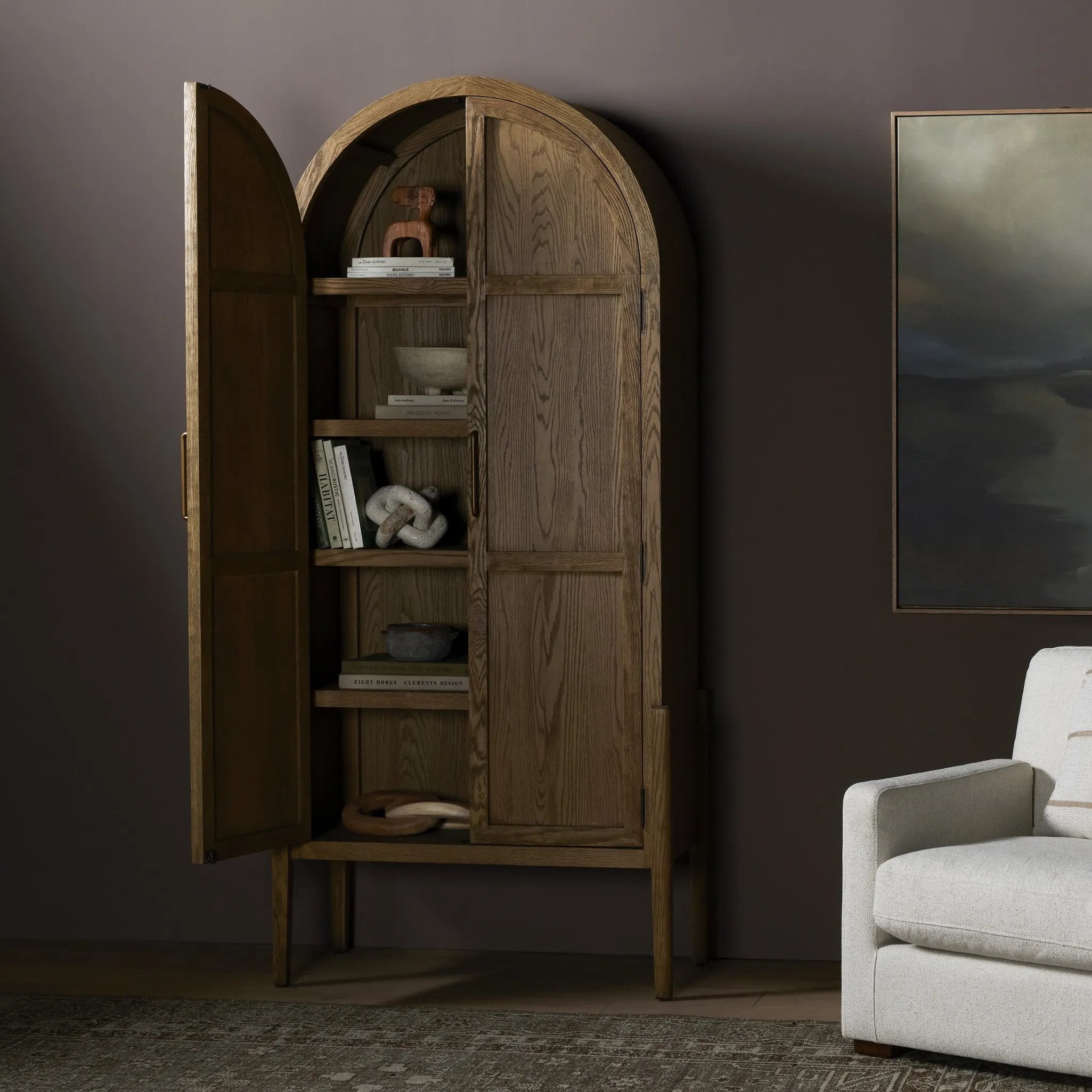 Featuring Tolle Drifted Oak Solid Panel Door Cabinet by Four Hands at Amethyst Home. Store it in style. Beautifully shaped cabinetry of solid oak with recessed wood panels and iron hardware in an antique brass finish. Features thick, spacious shelves to store kitchenware, favorite books and treasured objects.Overall Dimensions: 38.00"w x 19.00"d x 84.00"hW. Amethyst Home provides interior design, new home construction design consulting, vintage area rugs, and lighting in the Des Moines metro area.