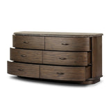 Mixed materials define this Art Deco-inspired dresser. Vein-rich marble in a warm cofffee color tops a sungkai case for a timeless yet modern look.As lovers of modern aesthetics at Amethyst, we love the warm modern inspired Tovae Dresser - Stained Saddle Brown Sungkai. Amethyst Home provides interior design, new home construction design consulting, vintage area rugs, and lighting in the Washington metro area.