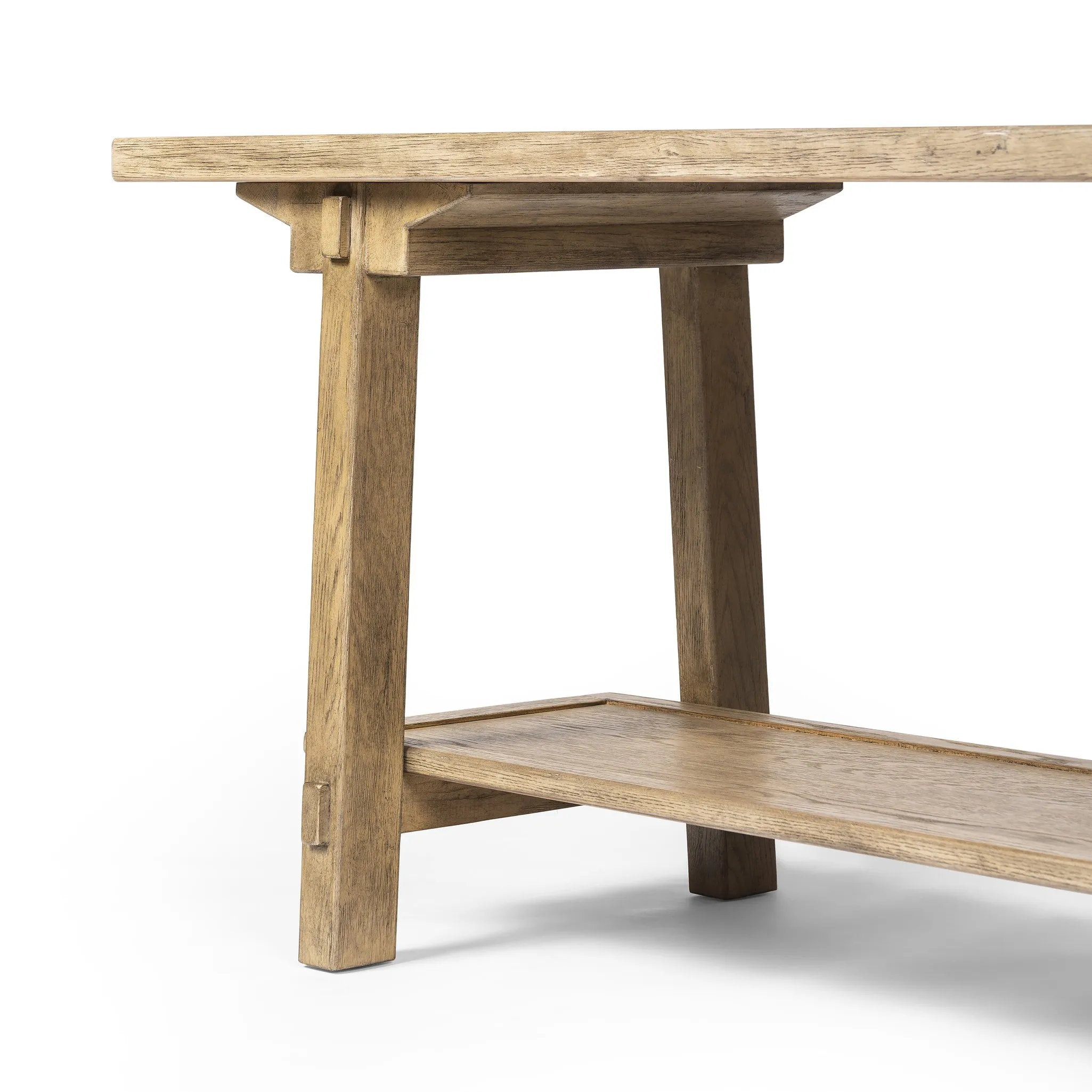 Featuring Trinity Distressed Light Oak Console Table by Four Hands at Amethyst Home. This Asian-inspired design made from light, distressed oak features mortise-and-tenon joinery, which connects protruding stretchers to sturdy legs. Lower shelving for bonus storage and display.Overall Dimensions: 78.00"w x 20.50"d x 27.00"hWeight : 96.78 lbsMaterials : Soli. Amethyst Home provides interior design, new home construction design consulting, vintage area rugs, and lighting in the Nashville metro area.