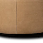 Great for smaller spaces or a reading nook, this petite slipper chair is wrapped in top-grain leather and backed with textured wood that folds into wings, cradling the head and shoulders for a little extra support. Features a 360-degree swivel base. Amethyst Home provides interior design, new home construction design consulting, vintage area rugs, and lighting in the Seattle metro area.