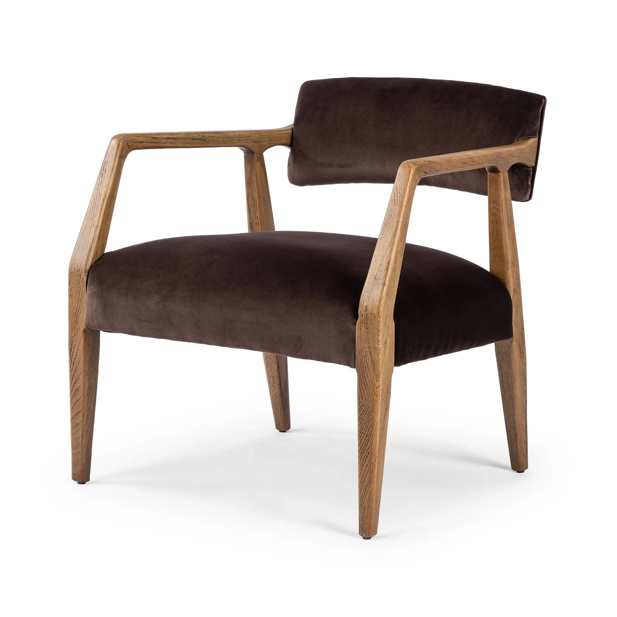 An angular frame of distressed nettlewood holds a deep seat and striking, low-slung back. Upholstered in a velvety cocoa cotton Amethyst Home provides interior design, new home construction design consulting, vintage area rugs, and lighting in the Dallas metro area.