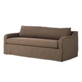 Meet the piece that can do it all. Coffee-colored fabric covers a long bench-style seat, while a concealed sleeper mechanism allows for easy pullout to transform this flexible piece into an extra bed. Curved slope arms finish into a fixed slipcover with kick-pleats at the front. Amethyst Home provides interior design, new home construction design consulting, vintage area rugs, and lighting in the Laguna Beach metro area.