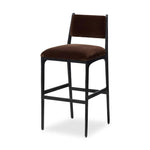 A metal frame with a tapered profile pairs with a velvety brown upholstered seat and back, striking balance in both scale in texture. Perfectly scaled for the counter.As lovers of wabi sabi design at Amethyst, we love the warm modern inspired Valeene Bar + Counter Stool. Amethyst Home provides interior design, new home construction design consulting, vintage area rugs, and lighting in the Tampa metro area.