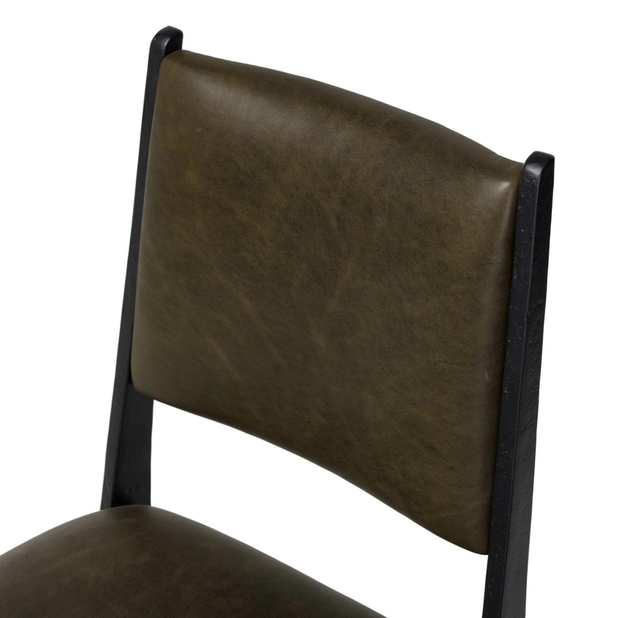 A metal frame with a tapered profile pairs with a moss-colored top-grain leather seat and back, striking balance in both scale in texture.As fans of wabi sabi aesthetics at Amethyst, we love the optimistic inspired Valeene Dining Chair - Dulane Moss. This item pairs well with other brands such as Surya and is perfect for minimalist homes Amethyst Home provides interior design, new home construction design consulting, vintage area rugs, and lighting in the Salt Lake City metro area.