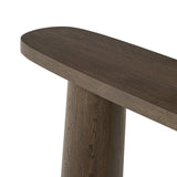 Featuring Valen Rustic Brown Oak Veneer Console Table by Four Hands at Amethyst Home. Made from rustic brown oak, an open-style console table is streamlined while not short on presence, with its exaggerated cylinder legs and polished pill-shaped top.Overall Dimensions: 78.00"w x 18.00"d x 32.00"hWeight : 99.21 lbsMaterials: Oak Veneer, Oak Plywood. Amethyst Home provides interior design, new home construction design consulting, vintage area rugs, and lighting in the Washington metro area.