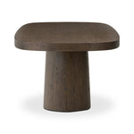 Smooth and shapely with heavy proportions, exaggerated cylinder legs pair with a softened pill-shaped top, with subtly arched sides. Made from oak veneer with a rustic brown finish, for a warm, welcoming look Amethyst Home provides interior design, new home construction design consulting, vintage area rugs, and lighting in the Charlotte metro area.