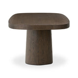 Smooth and shapely with heavy proportions, exaggerated cylinder legs pair with a softened pill-shaped top, with subtly arched sides. Made from oak veneer with a rustic brown finish, for a warm, welcoming look Amethyst Home provides interior design, new home construction design consulting, vintage area rugs, and lighting in the Charlotte metro area.
