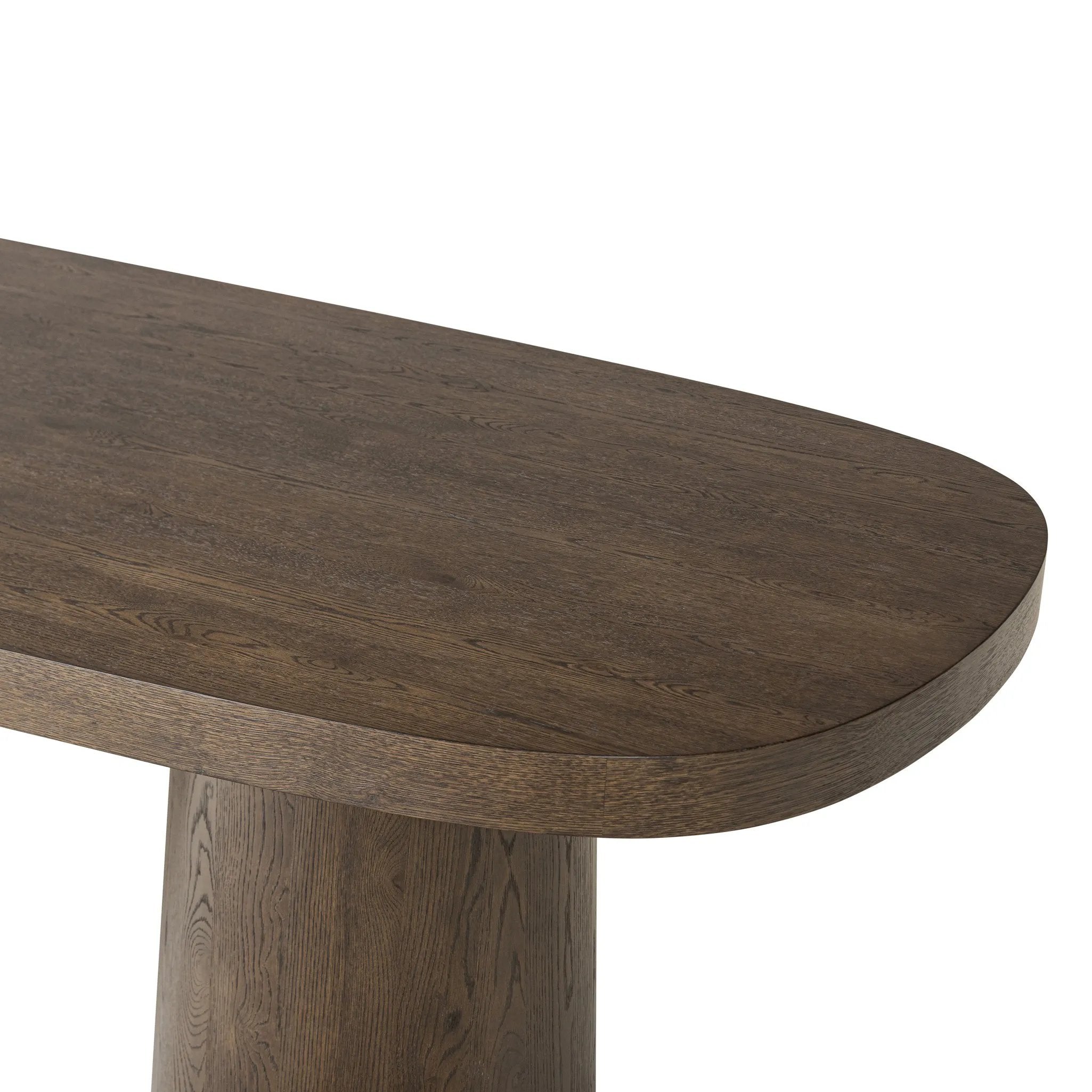 Smooth and shapely with heavy proportions, exaggerated cylinder legs pair with a softened pill-shaped top, with subtly arched sides. Made from oak veneer with a rustic brown finish, for a warm, welcoming look Amethyst Home provides interior design, new home construction design consulting, vintage area rugs, and lighting in the Omaha metro area.