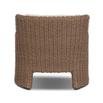 This outdoor chair's sculpted shape mimics classic wingback armchairs, with a double-twist woven material framing heavily textured boucle fabric for added visual weight. Cover or store inside during inclement weather or when not in use. Amethyst Home provides interior design, new home construction design consulting, vintage area rugs, and lighting in the San Diego metro area.