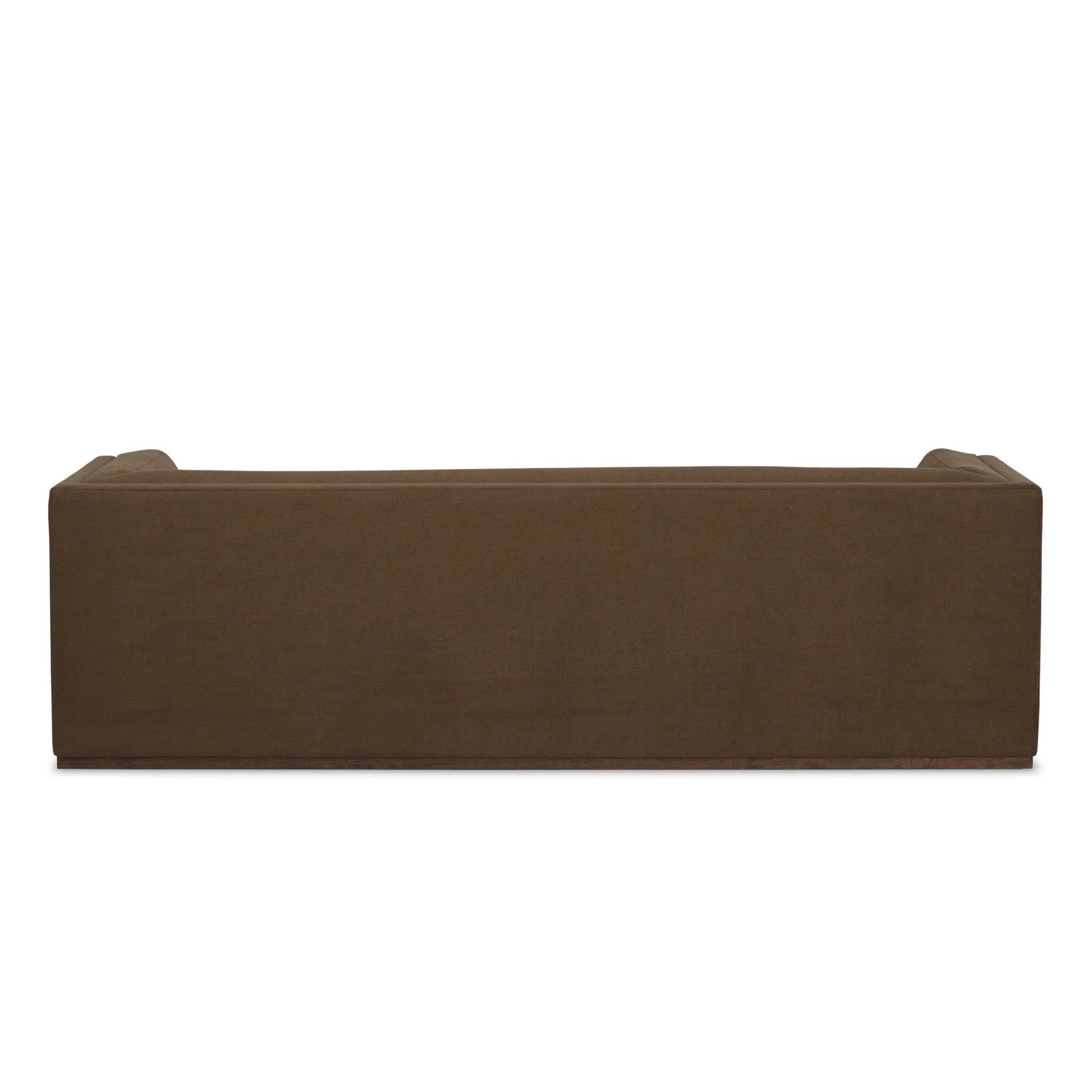 An inviting take on the classic tuxedo sofa, made for modern living. Celebrating mitered corners, for precision at every angle, and a layered, upholstered frame for a sharp, architectural look, the sofa rests on a wood plinth base. Tailored in the United States with thick pocket-seam cushions for unexpected comfort. Amethyst Home provides interior design, new home construction design consulting, vintage area rugs, and lighting in the Scottsdale metro area.