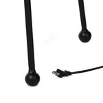 An exaggeratedly slim, airy tripod base of black-finished iron supports a light beige shade of 100% cotton, for a classic look with contrast Amethyst Home provides interior design, new home construction design consulting, vintage area rugs, and lighting in the Miami metro area.