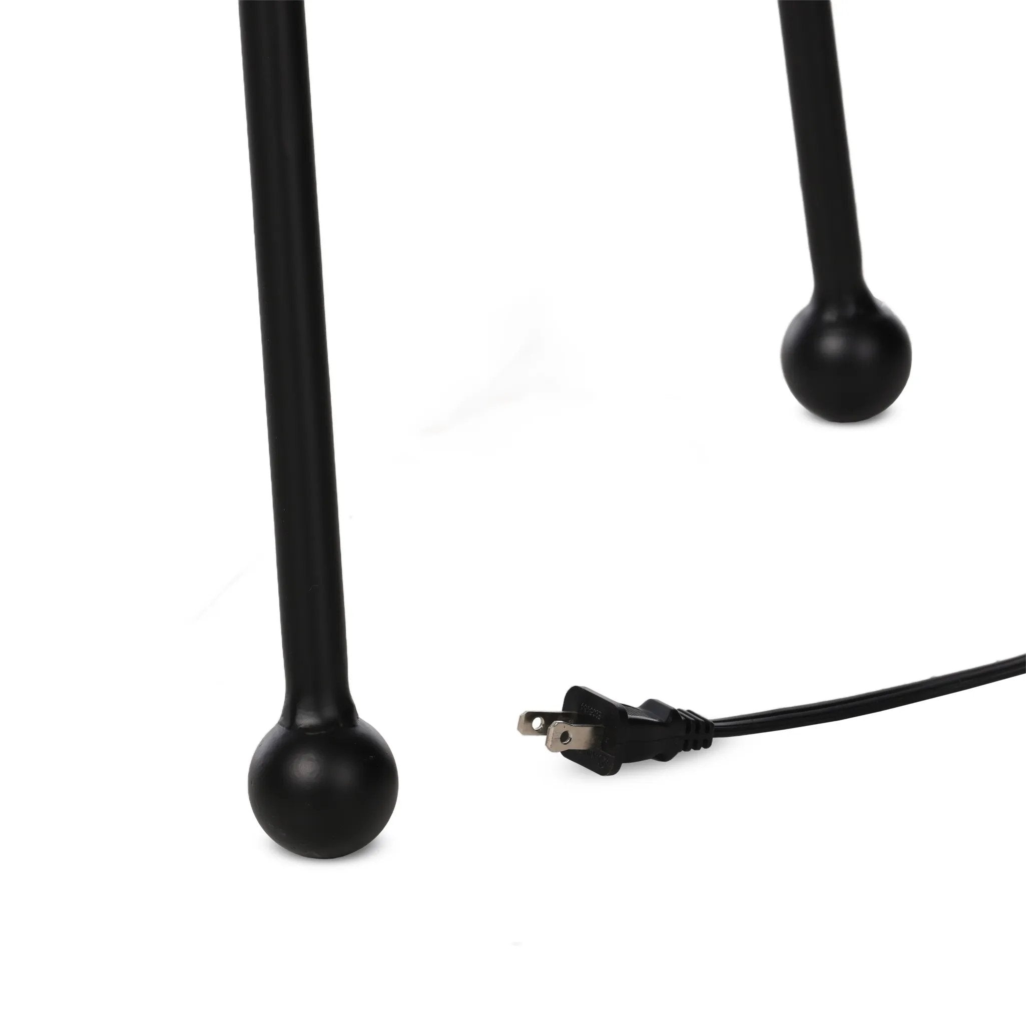 An exaggeratedly slim, airy tripod base of black-finished iron supports a light beige shade of 100% cotton, for a classic look with contrast Amethyst Home provides interior design, new home construction design consulting, vintage area rugs, and lighting in the Miami metro area.