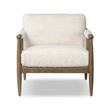 Featuring Warren Ivan Snow Chair by Four Hands at Amethyst Home. A classic silhouette through a contemporary lens. Framed in vintage oak, this accent chair features tapered legs, spindles along the arms and bauble details. Finished in Turkish-made upholstery with a heavy pile that blends brushed, pulled and boucle styles, it's woven into a subtle linear pattern. Amethyst Home provides interior design, new home construction design consulting, vintage area rugs, and lighting in the Omaha metro area.