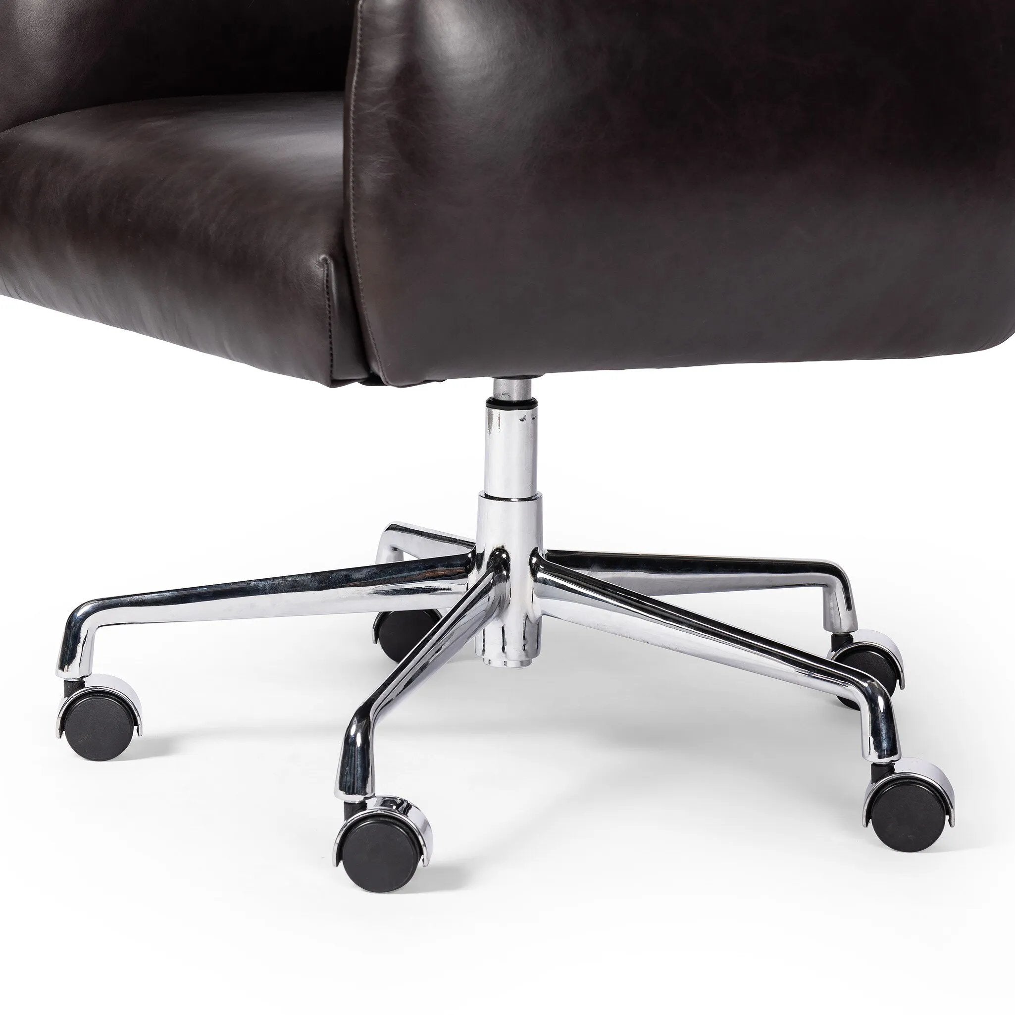 Featuring Wayland Sonoma Black Desk Chair by Four Hands at Amethyst Home. Pillowy knife-edge arms wrapped in black top-grain leather enhance the classic silhouette of this executive-sized desk chair. A polished aluminum swivel base features casters and height adjustability for added ease.
Overall Dimensions: 30.5" L x 29.0 " W x 42.0" H
Materials: Top G. Amethyst Home provides interior design, new home construction design consulting, vintage area rugs, and lighting in the Winter Garden metro area.
