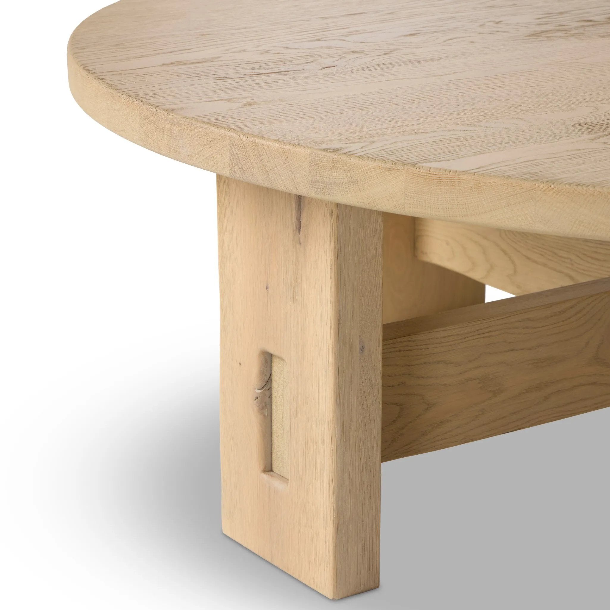 Simple in shape, high in quality. Made from bleached character oak that's been sustainably sourced from Romania, this rounded coffee table features paddle legs with stretcher details.As fans of luxe aesthetics at Amethyst, we love the nature inspired Willa Coffee Table. Amethyst Home provides interior design, new home construction design consulting, vintage area rugs, and lighting in the Des Moines metro area.