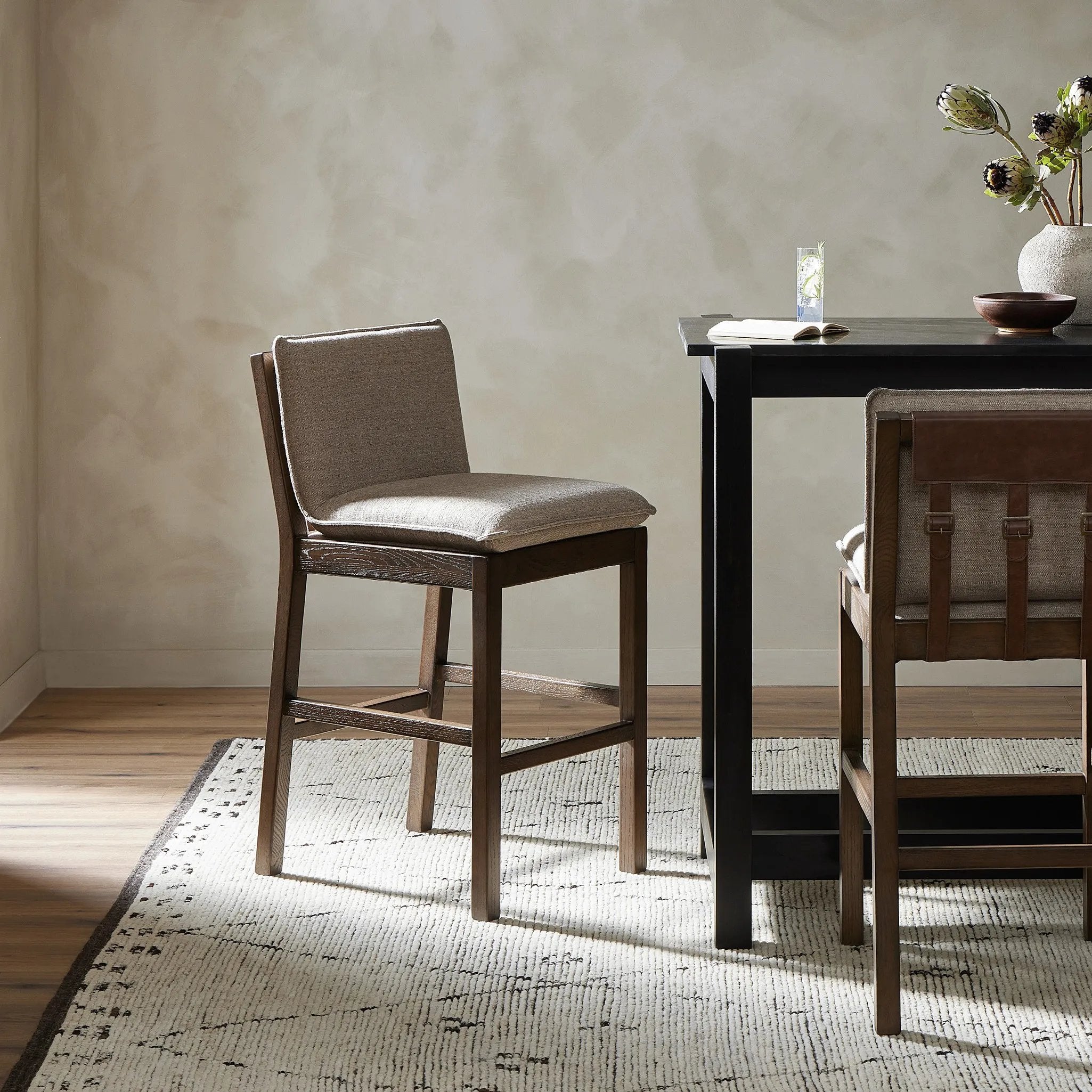 Featuring Wilmington Alcala Fawn Counter Stool by Four Hands at Amethyst Home. Almond-finished parawood frames cushioned seating upholstered in high-performance fabric. Perfectly sized for the counter.Overall Dimensions: 20.00"w x 25.50"d x 37.00"hWeight : 24.69 lbsMaterials: 70% Polyester, 20% Viscose (Rayon), 10% Flax/Linen, Solid Oak, Top Grain Leather. Amethyst Home provides interior design, new home construction design consulting, vintage area rugs, and lighting in the Washington metro area.