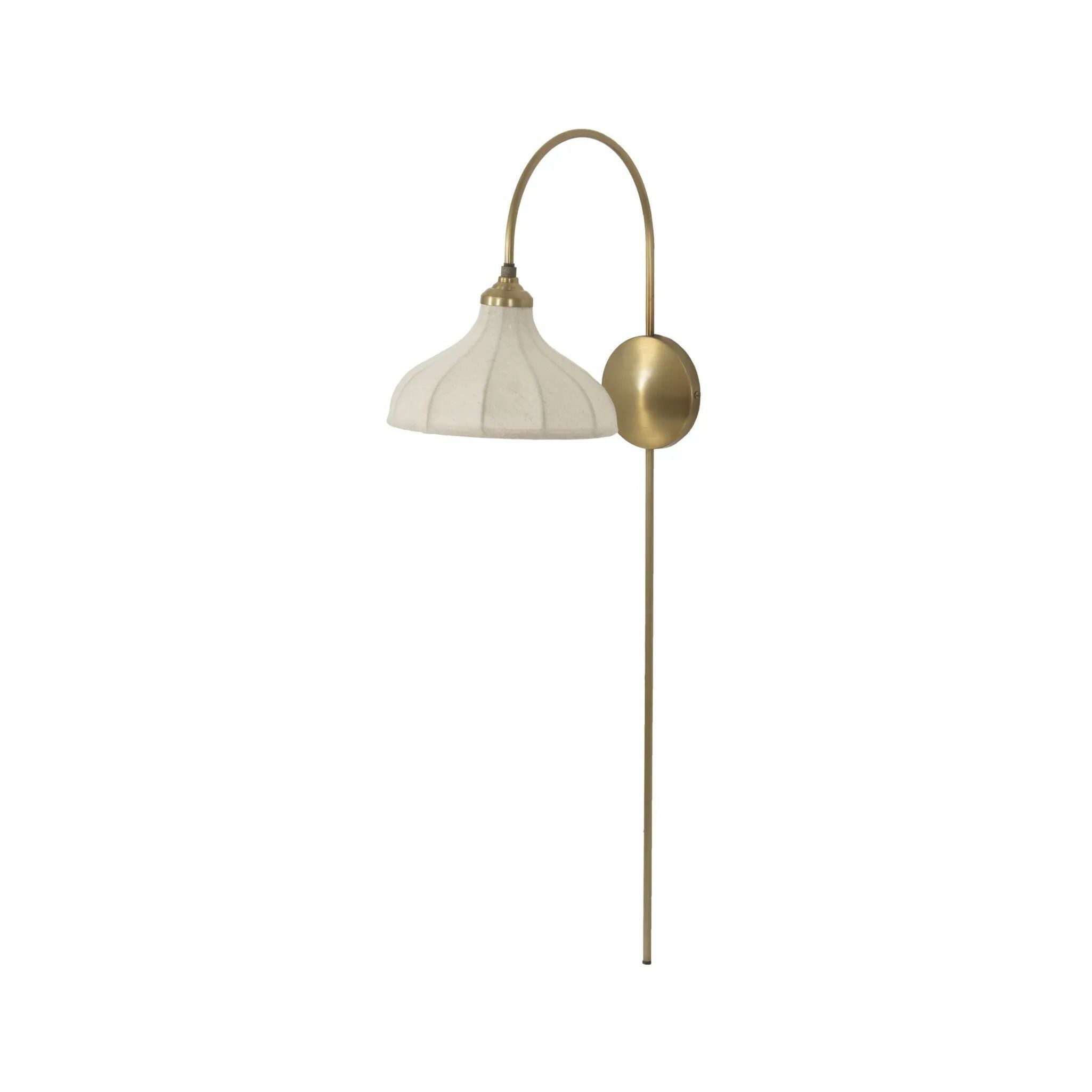 Slim and curved, a swan-neck arm supports a bell-shaped linen shade with brass boning, updating a traditional lighting look. This plug-in sconce design brings warm illumination to any space while discreet cord management keeps the look polished. Ideal for crafting warm, inviting reading corners or bedside ambiance Amethyst Home provides interior design, new home construction design consulting, vintage area rugs, and lighting in the Washington metro area.