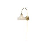 Slim and curved, a swan-neck arm supports a bell-shaped linen shade with brass boning, updating a traditional lighting look. This plug-in sconce design brings warm illumination to any space while discreet cord management keeps the look polished. Ideal for crafting warm, inviting reading corners or bedside ambiance Amethyst Home provides interior design, new home construction design consulting, vintage area rugs, and lighting in the Winter Garden metro area.