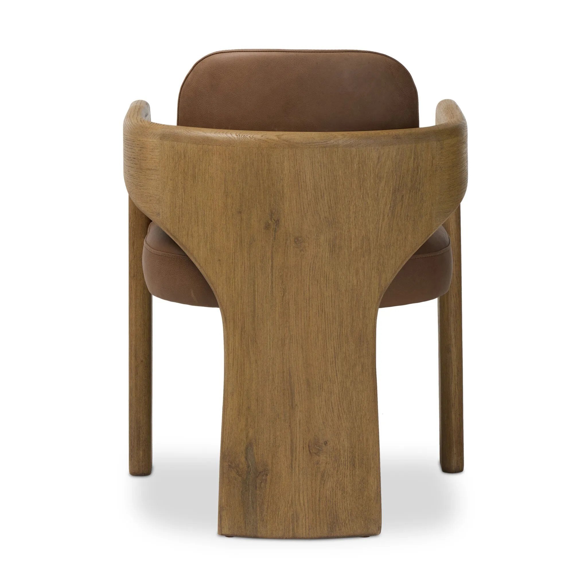 Striking from every view. This statement-making dining chair combines solid oak in tripod form with top-grain leather. The cantilever design, with a wide plank back and sloping arms, form an eye-catching silhouette for the floating seat and overflowing back cushion. Amethyst Home provides interior design, new home construction design consulting, vintage area rugs, and lighting in the Salt Lake City metro area.