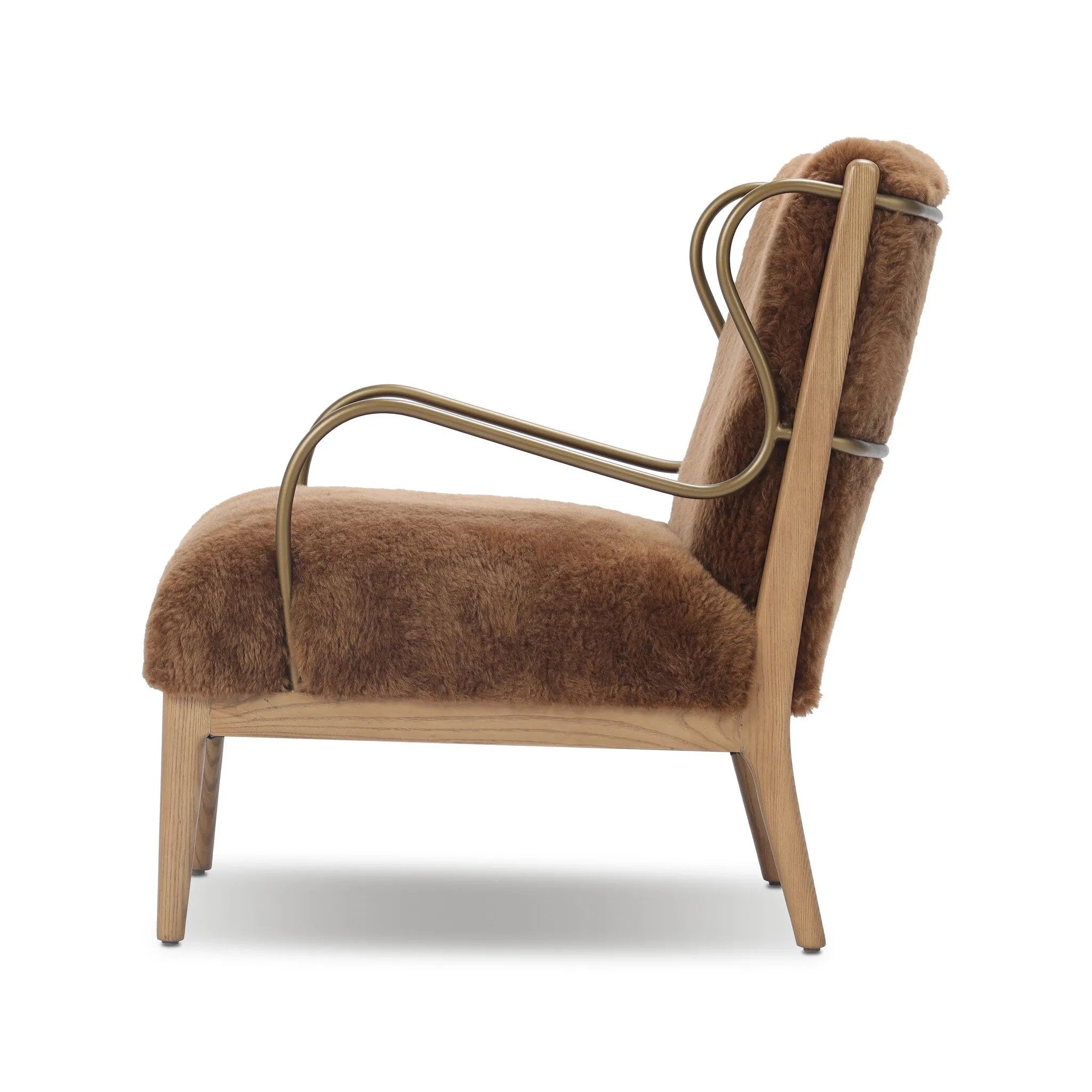 Bring the soul of a vintage find to your living room with this artfully updated accent chair. Solid ash legs and swooping iron arms give it a curated look, while a plush seat ensure comfort. Wrapped in cozy shearling to make any room feel instantly inviting. Amethyst Home provides interior design, new home construction design consulting, vintage area rugs, and lighting in the San Diego metro area.