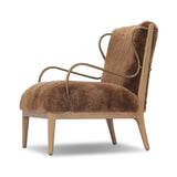 Bring the soul of a vintage find to your living room with this artfully updated accent chair. Solid ash legs and swooping iron arms give it a curated look, while a plush seat ensure comfort. Wrapped in cozy shearling to make any room feel instantly inviting. Amethyst Home provides interior design, new home construction design consulting, vintage area rugs, and lighting in the Seattle metro area.