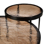 Smoky brown glass tops with slim, tapered matte black metal frames in a sleek, contemporary design. Available as a nesting set or standalone tables.Collection: Marlo Amethyst Home provides interior design, new home construction design consulting, vintage area rugs, and lighting in the Seattle metro area.