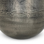 Futuristic-like metal with an antiqued finish, shaped into a cast planter with textural movement that catches the light. Safe for any space, indoor or out. Cover or store indoors during inclement weather and when not in use.As enthusiasts of natural style at Amethyst, we love the designer inspired Zavia Metal Planter - Raw Antique Nickel. Amethyst Home provides interior design, new home construction design consulting, vintage area rugs, and lighting in the Scottsdale metro area.