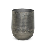 Futuristic-like metal with an antiqued finish, shaped into a cast planter with textural movement that catches the light. Safe for any space, indoor or out. Cover or store indoors during inclement weather and when not in use.As enthusiasts of natural style at Amethyst, we love the designer inspired Zavia Metal Planter - Raw Antique Nickel. Amethyst Home provides interior design, new home construction design consulting, vintage area rugs, and lighting in the Winter Garden metro area.